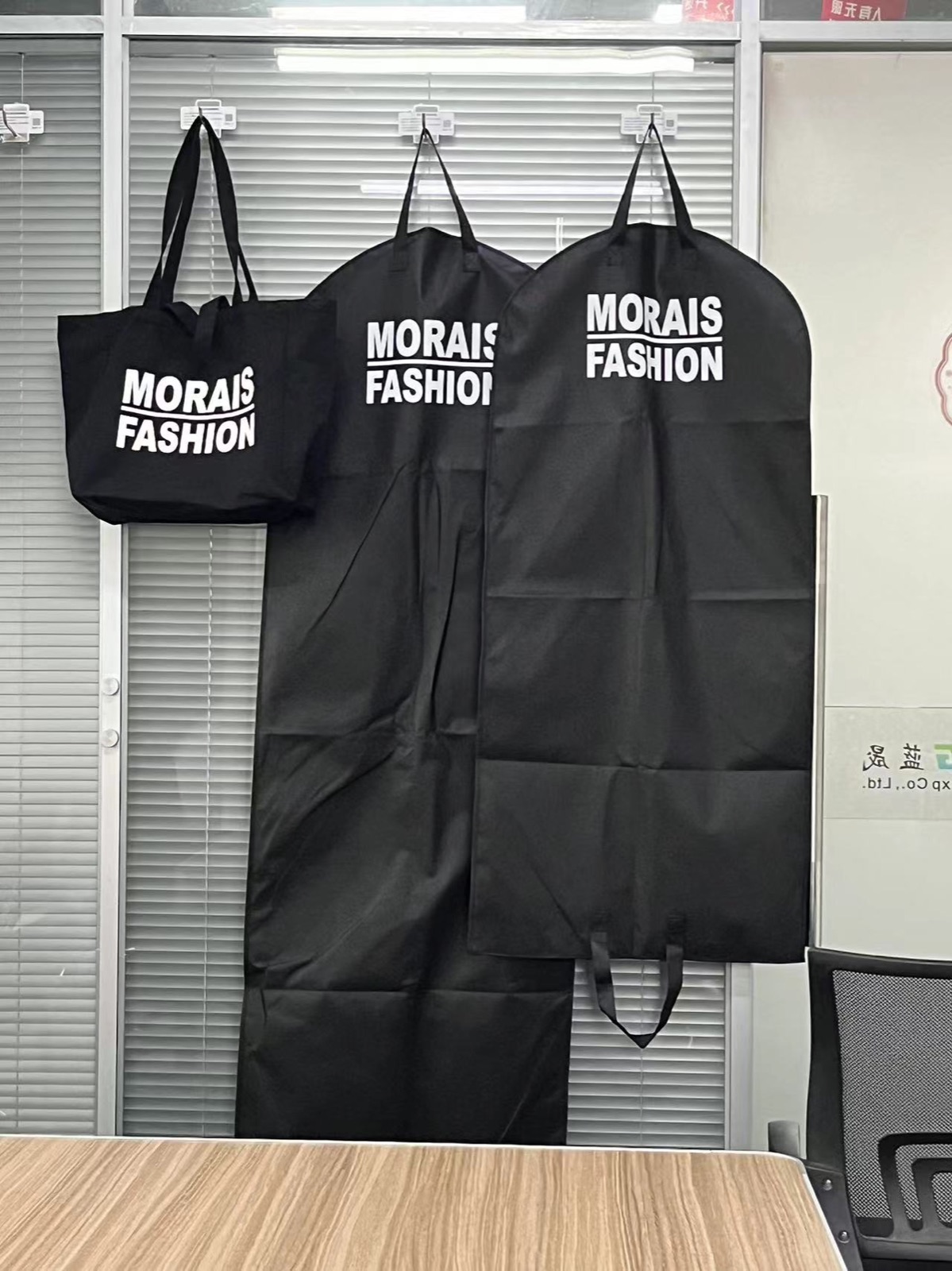 Matching custom tote bag and garment bags for one fashion brand