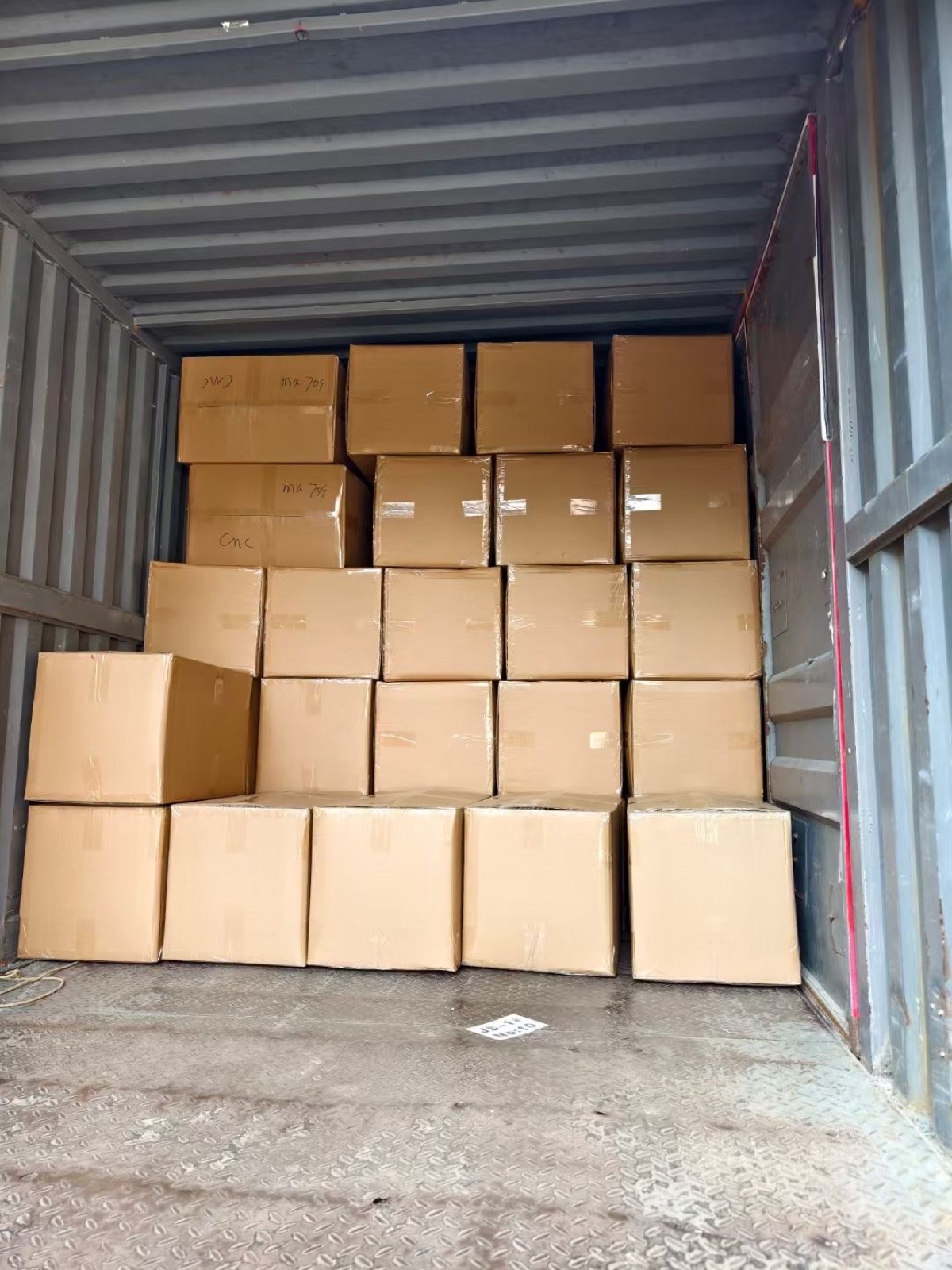 Finished custom bag order cartons loaded in a container for shipment