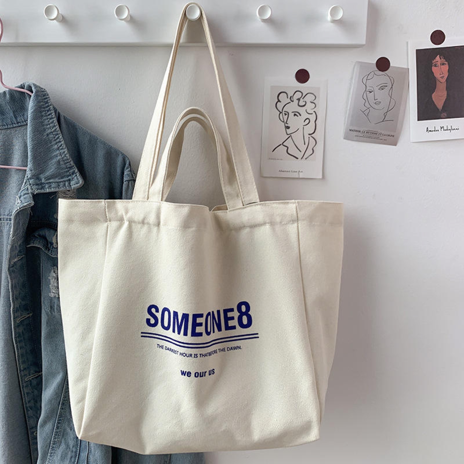 Different sizes of blank natural cotton tote bags displayed together